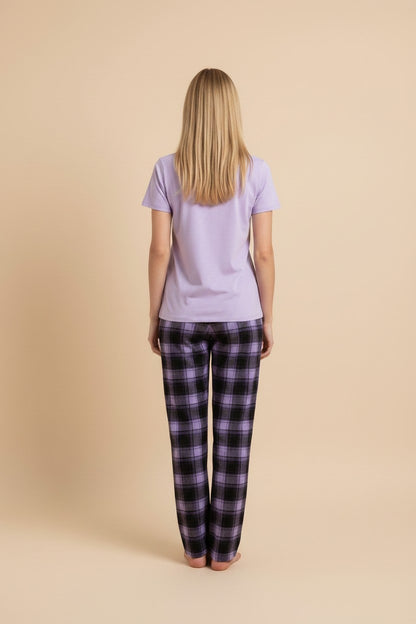 pyjama women's purple cotton pajama set with a plain t-shirt and purple and black plaid trousers, back view