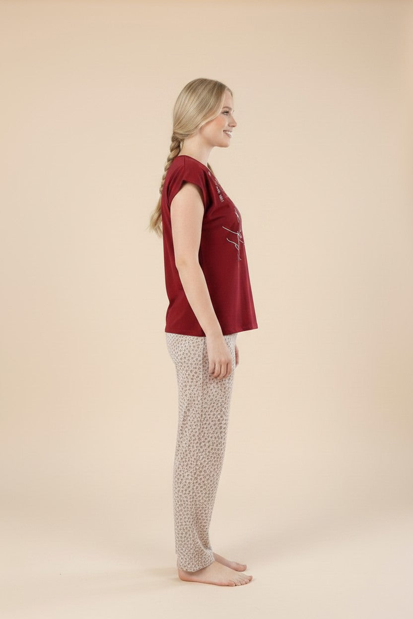 pyjama women's red cotton pajama set with patterned trousers worn by a blonde model in profile view