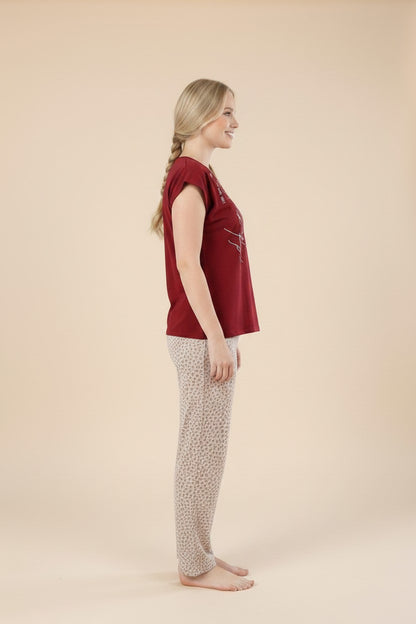 pyjama women's red cotton pajama set with patterned trousers worn by a blonde model in profile view