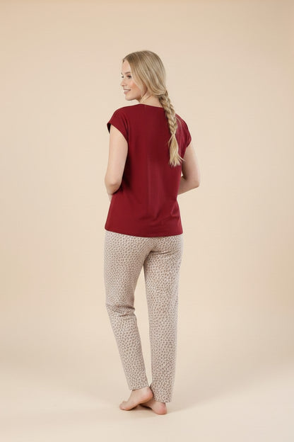 pyjama women's red cotton pajama set with a solid red top and patterned trousers, shown from the back