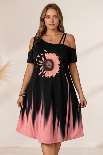 pyjama Sunset Bloom Dress featuring a black cold-shoulder design with a pink sunflower print and ombré hem