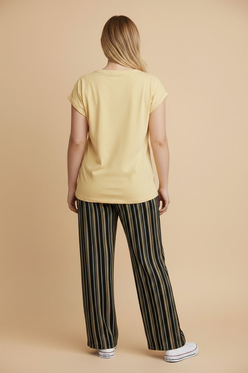 pyjama women's yellow cotton t-shirt and striped trousers set viewed from the back on a model
